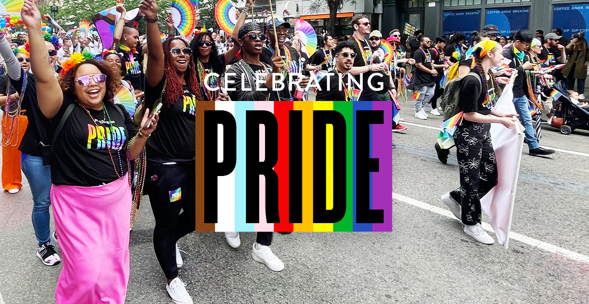 Celebrating Pride - Nordstrom employees at Pride Parade holding banner